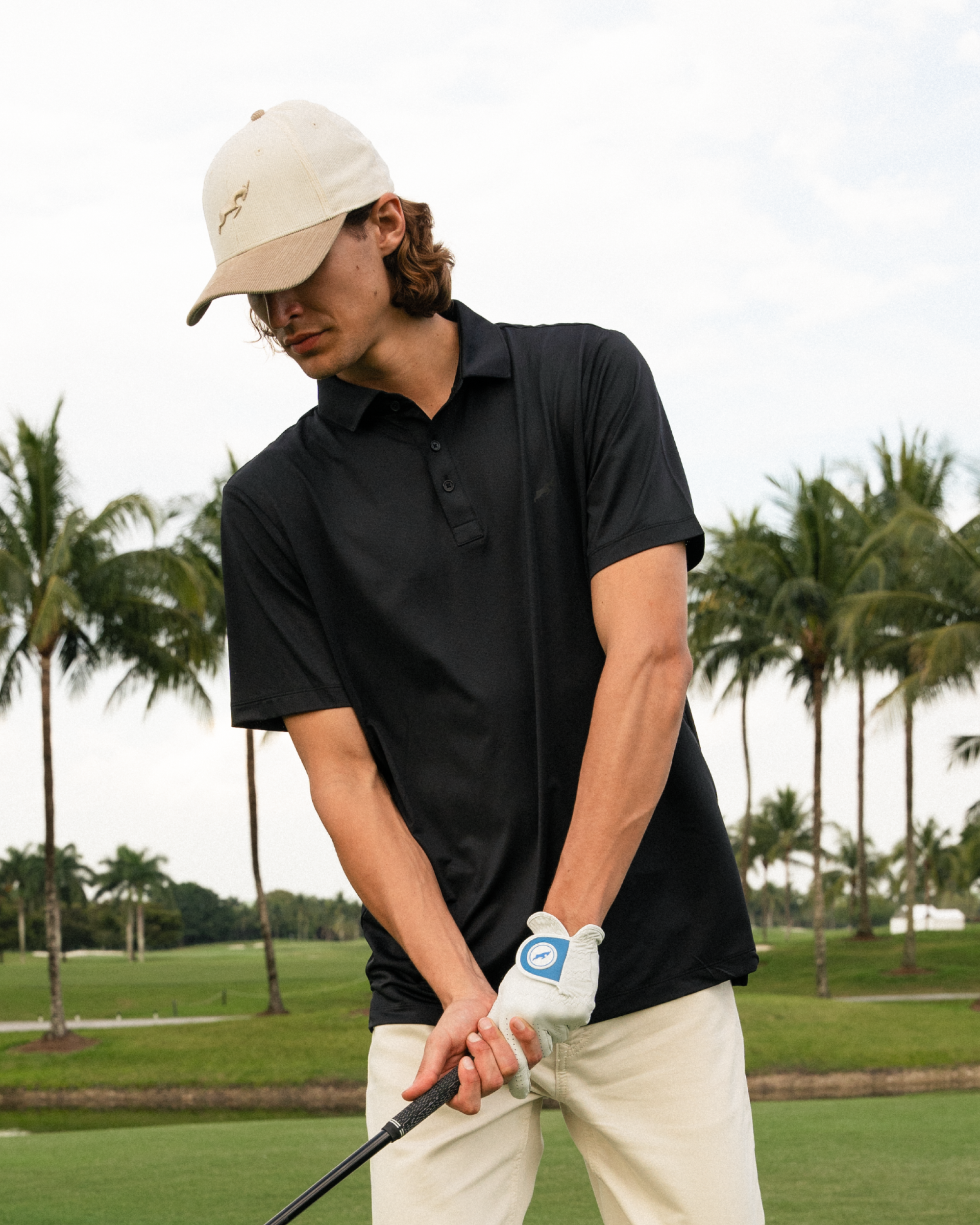 Svart golfpikétröja med mesh-teknik